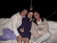 The girls are being silly on the boat....