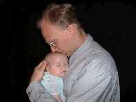 Daddy is good to sleep on...